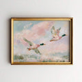 Pastel flying mallard duck marsh artwork in a gold frame