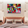 Framed boxing fight artwork above a pale bedroom headboard between bedside pendant lights
