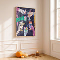 Halloween wall art displayed above pumpkins and candles in a bright room