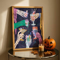 Wood-framed spooky cocktail canvas beside a jack-o-lantern and autumn leaves