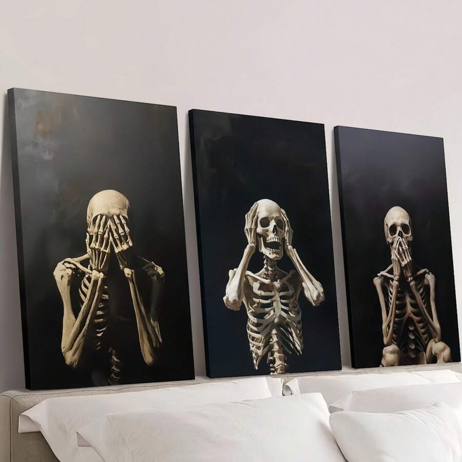 Three ivory skeleton posters displayed over a bed on dark backgrounds