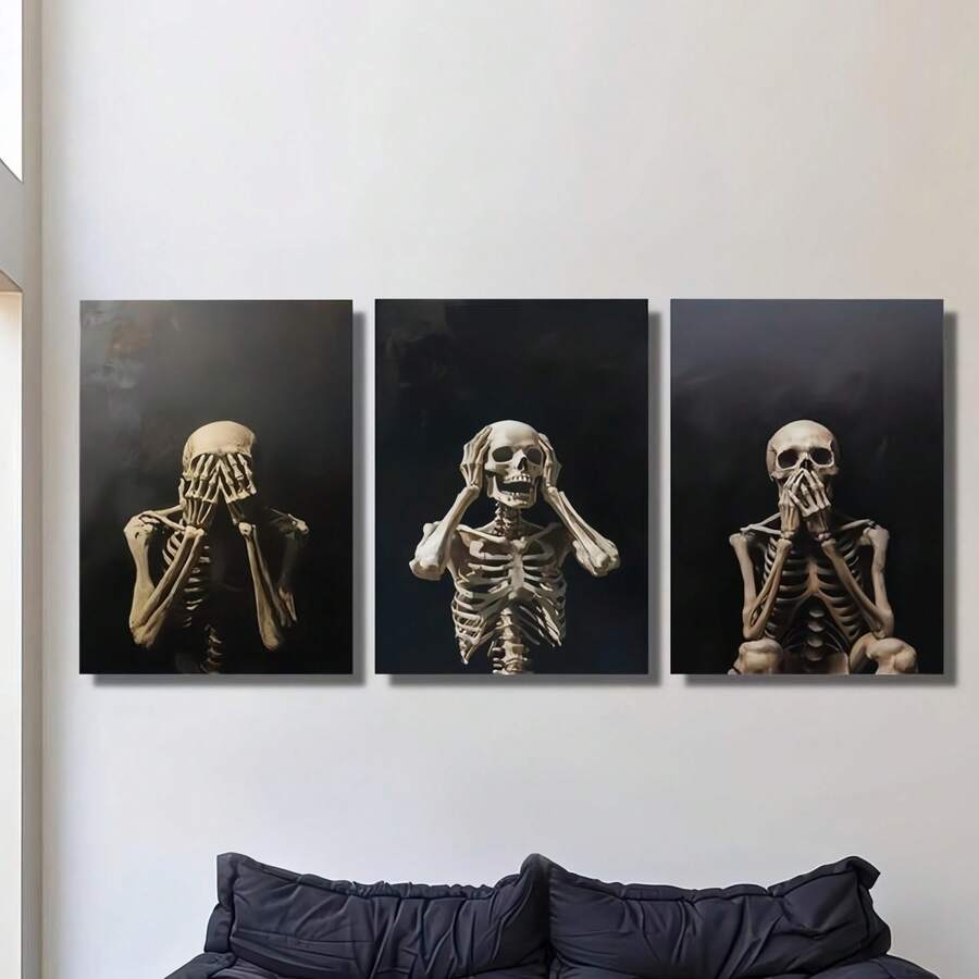 Gothic skeleton triptych hanging above a dark sofa on a pale wall