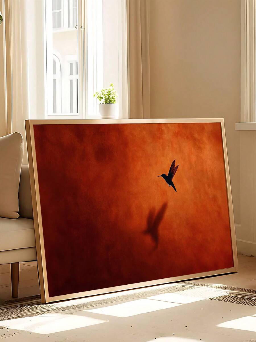 Hummingbird wall art with marigold bouquet presented in a framed-room setting