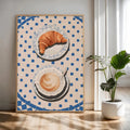 Blue tile breakfast canvas leaning against a white sofa in a bright room