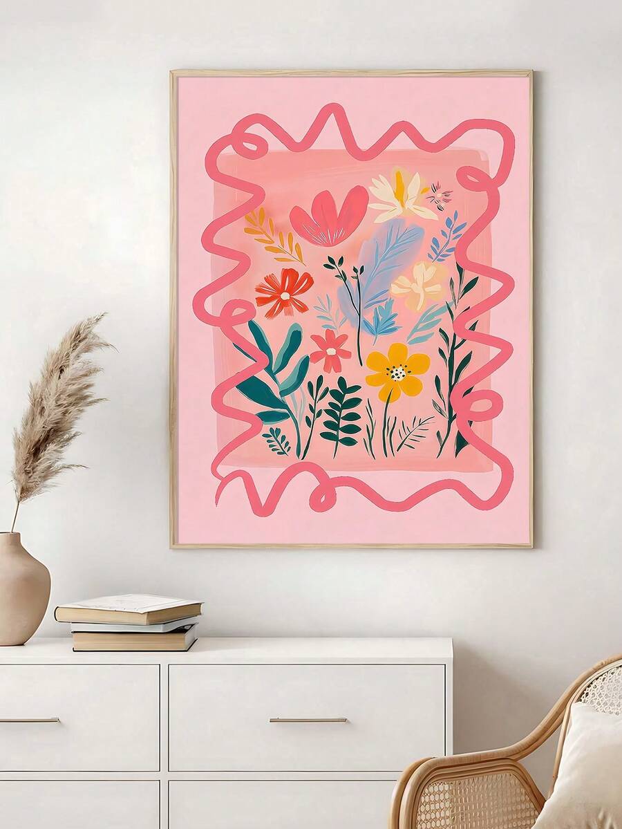 Pink botanical flower canvas poster in a light wood frame above a cabinet