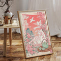 Pink tiger and blossom canvas poster displayed on a low wooden table in a bright neutral room