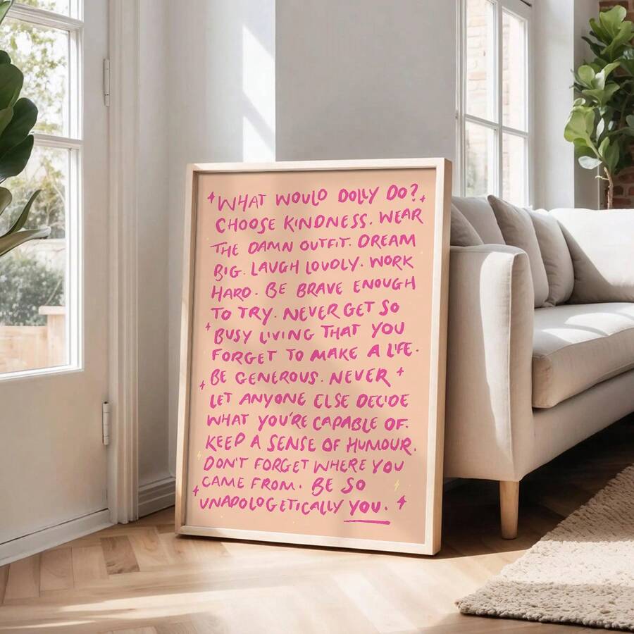 Uplifting pink typography canvas displayed beside neutral living room sofa