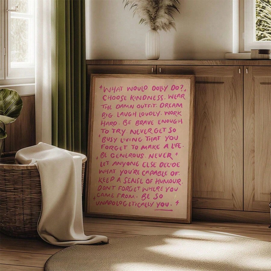 Blush quote canvas leaning against wood cabinet beside woven basket