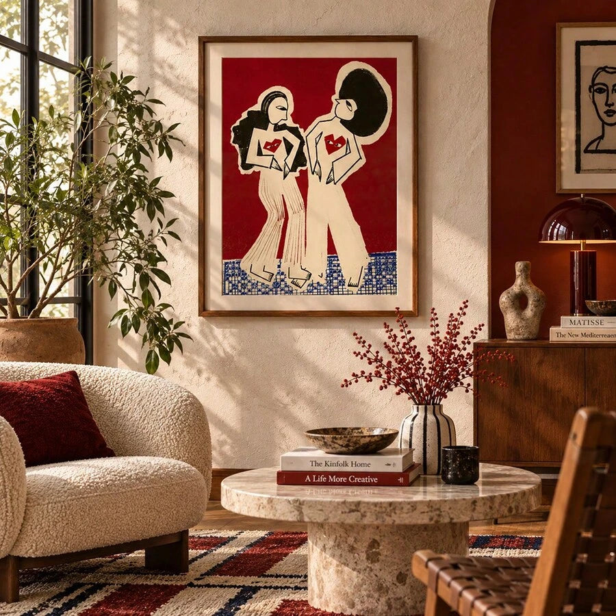 Bold fashion illustration framed above a console in a red-accented living room