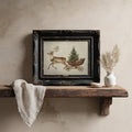 Reindeer sleigh canvas styled on a rustic shelf beside a pale ceramic vase