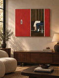 Red and dark-curtain figure study displayed above a warm wood console