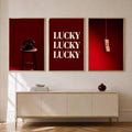 Framed lucky typography canvas poster with repeated cream LUCKY lettering on a deep red background