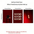 Single framed lucky typography poster displayed above a burgundy sofa in a modern room