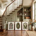 Framed lily, cottage tulip and floral prints arranged by a stair landing