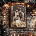 Painterly Holy Family canvas print shown in a light frame with evergreen decor