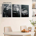 Vintage car wall art set displayed above a brown leather sofa
