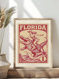 Vintage western stamp artwork displayed with books and natural wood decor