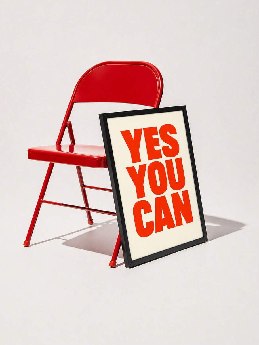 Framed red YES YOU CAN typography canvas leaning by blue-and-white bedroom rug