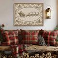 Sepia Santa sleigh Christmas poster in a gold-toned frame above a rustic bench with red plaid cushions and stacked firewood