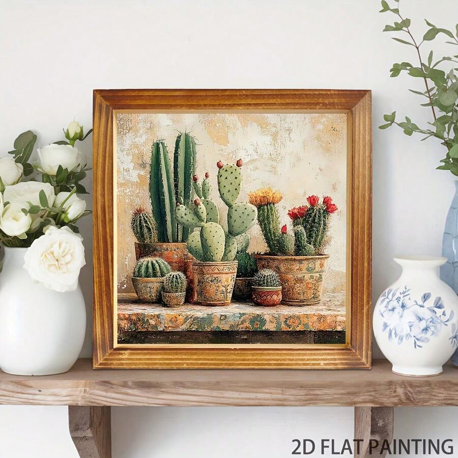 Framed cactus canvas displayed on a wooden console beside white flowers