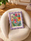 Wildflower print in a lilac frame on a cream upholstered chair