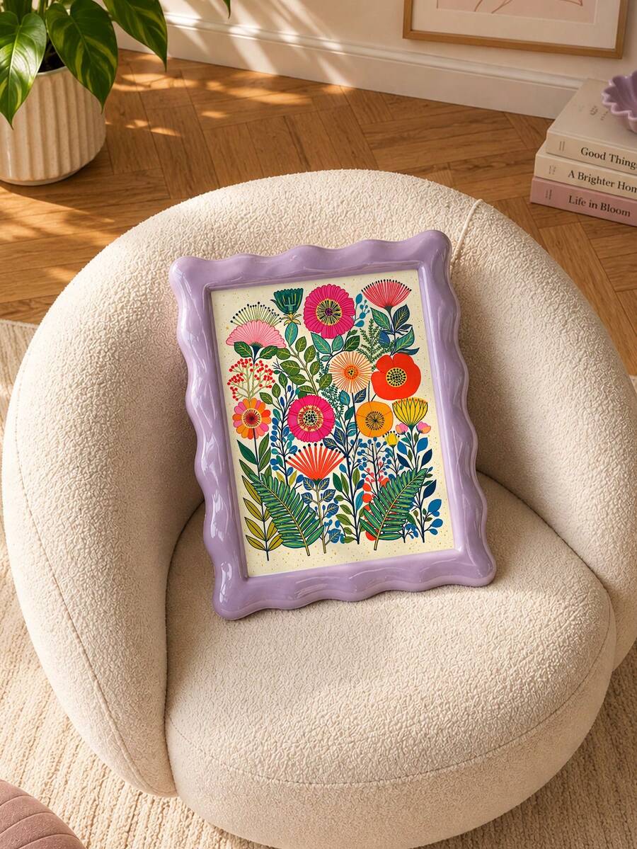 Wildflower print in a lilac frame on a cream upholstered chair
