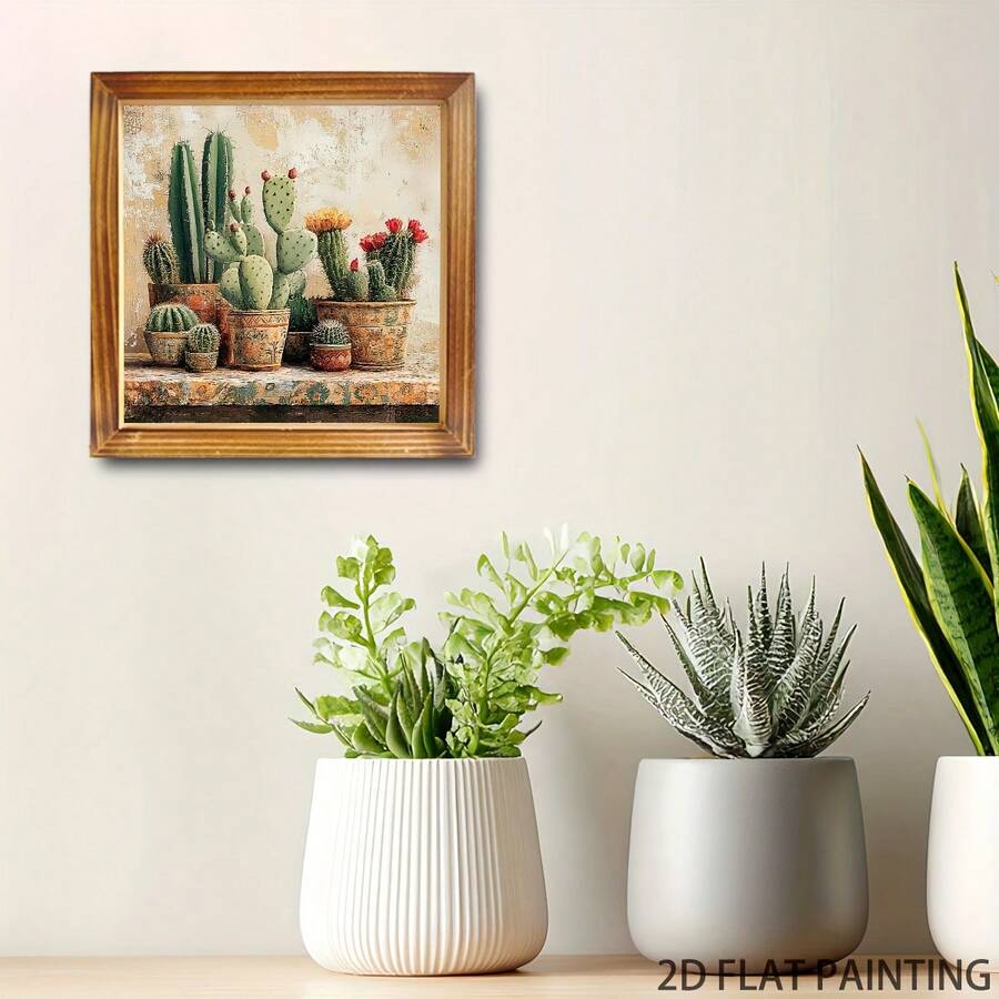 Square cactus canvas above white planters and succulents on a bright wall