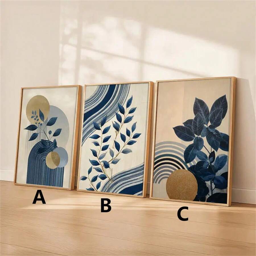 Three coordinated navy botanical panels labeled A B and C leaning against a warm neutral wall