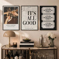 Black-framed trio of vintage newspaper quote and ticket poster prints above a console