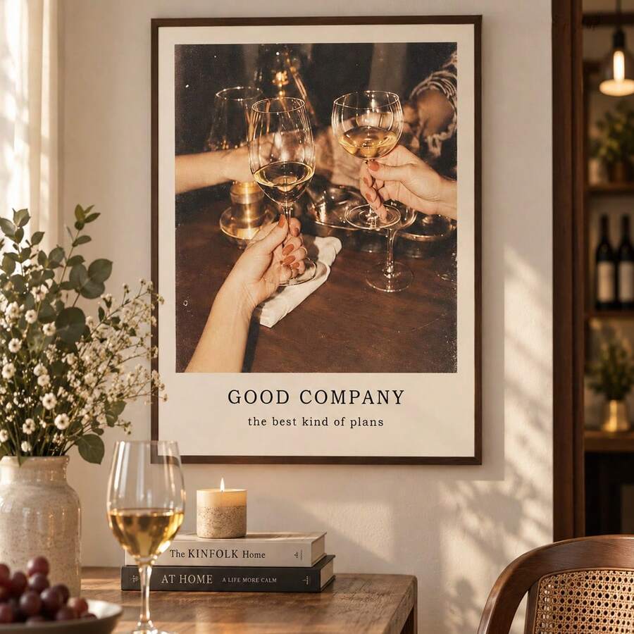 Cocktail toast photograph print with Good Company caption in a warm dining interior