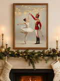 Ballerina and nutcracker holiday art displayed above a candlelit garland mantel