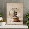 Framed Christmas snow globe artwork displayed in a warm living space