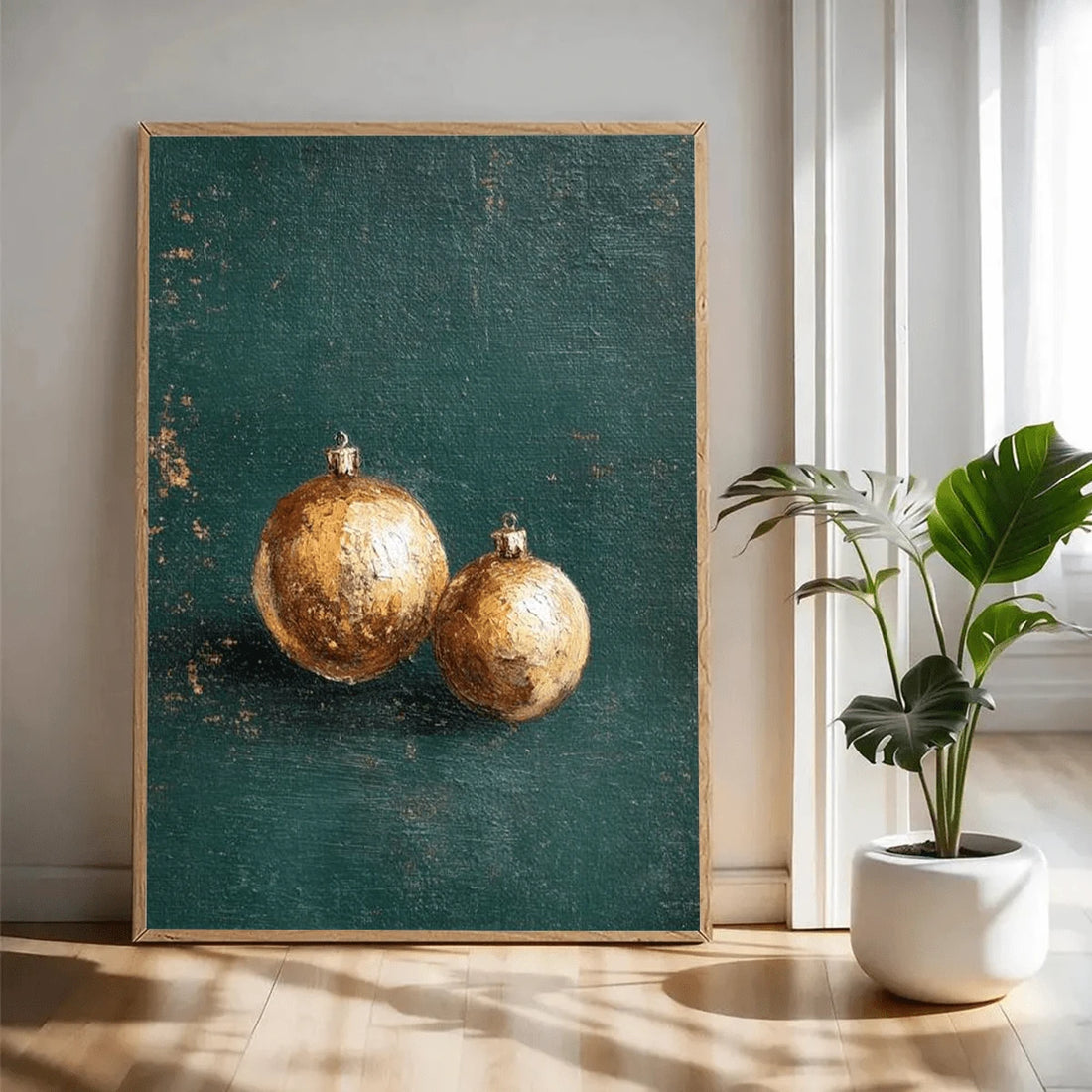 Gold bauble canvas in a gold frame beside a lit Christmas tree