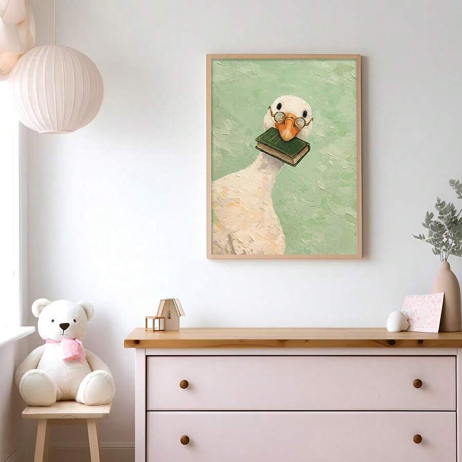 Mint-green goose reading poster displayed above a pale dresser