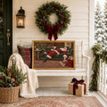 Framed Santa canvas displayed on a decorated porch with wreath and wrapped present