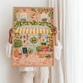 Mediterranean fruit basket artwork held in a light wood frame