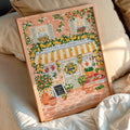 Lemon market canvas poster framed beside a sunlit bed