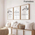 Frameless cream scripture wall art triptych displayed over a neutral living-room sofa
