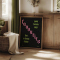 Framed lyric canvas displayed beside warm wood cabinetry and a bright window