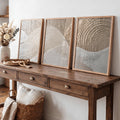Japanese minimalist canvas set styled on rustic console beside dried flowers