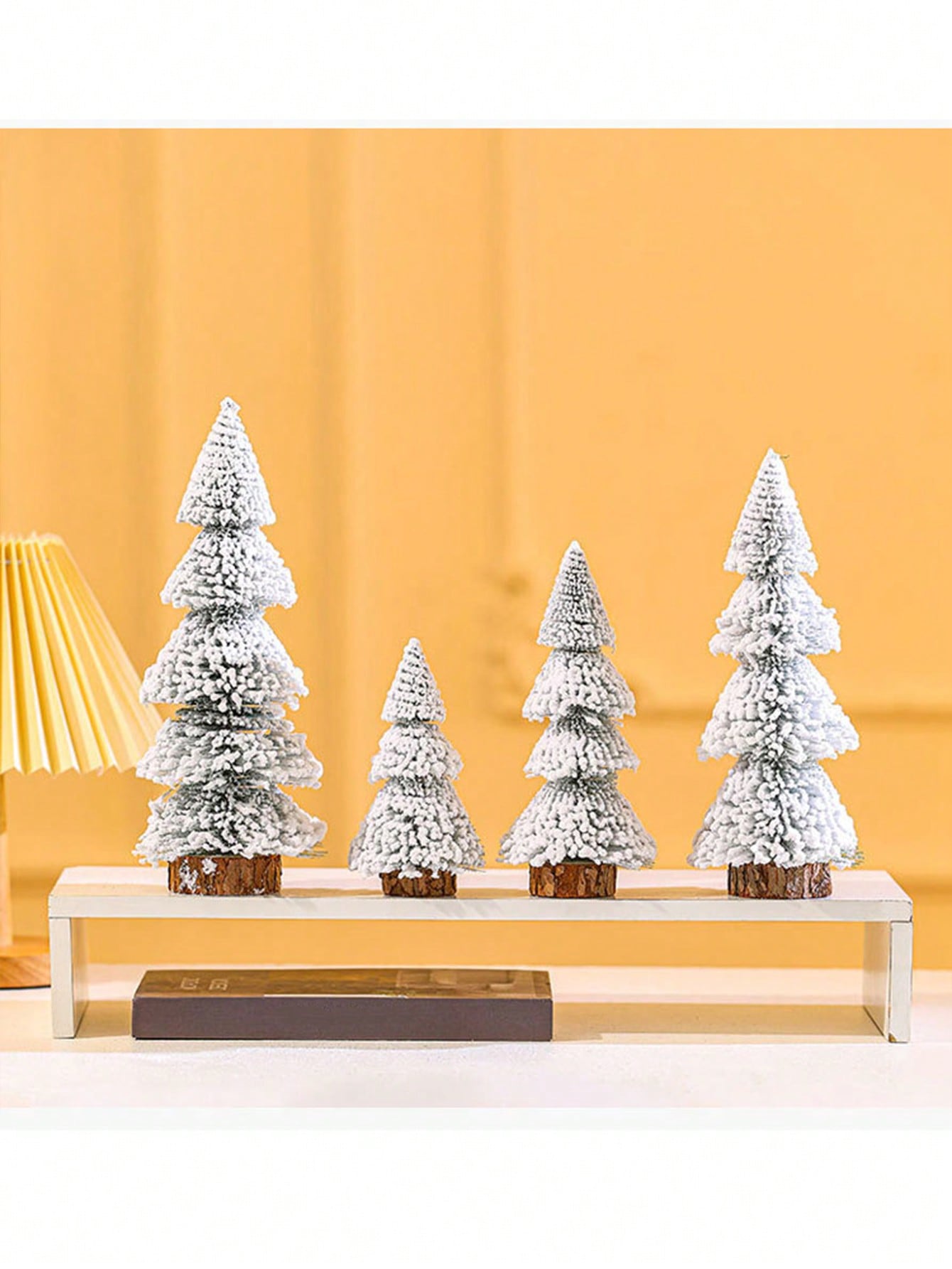 Introduce a touch of holiday cheer with our 1PC Tower Shaped Flocked Cedar Tree. The artificial tree is designed with a wooden base for added stability and features a festive flocked finish that replicates a real cedar tree. Add a natural and cozy feel to your holiday decor with this beautiful and easy-to-assemble tree.