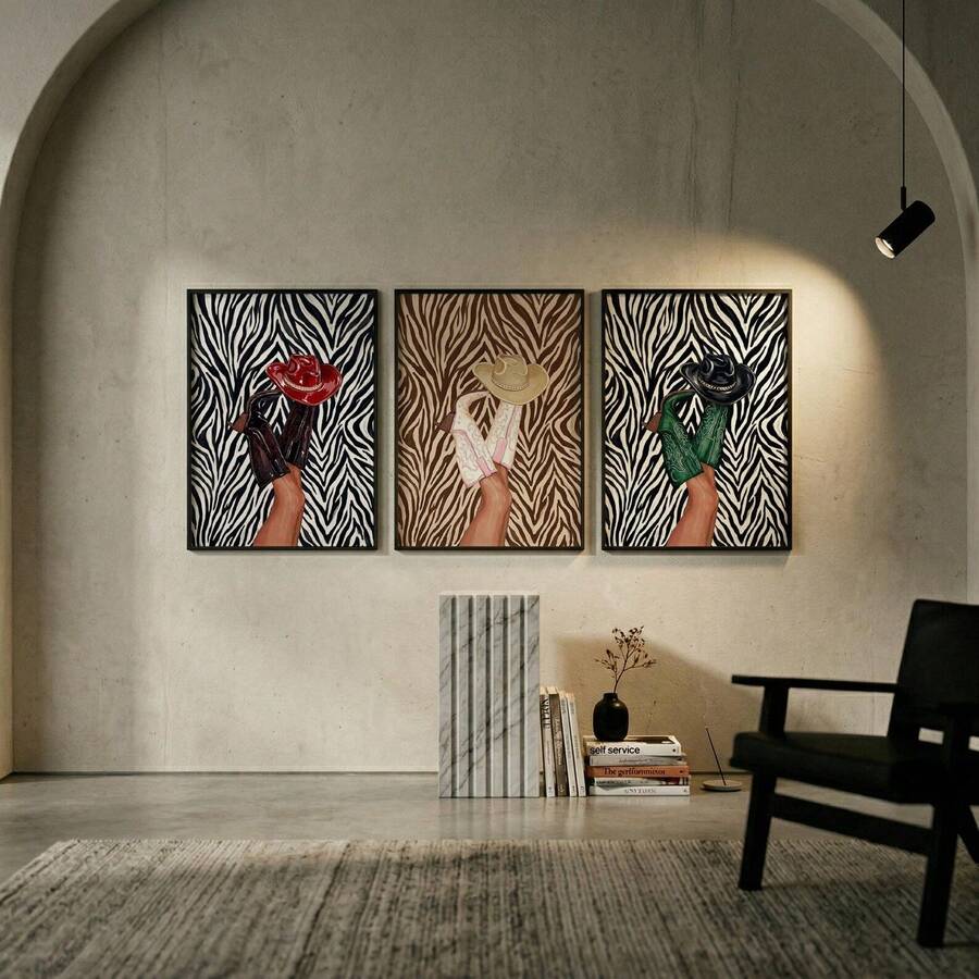 Three framed zebra-print cowboy boot artworks in an arched modern living room