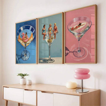 Three piece retro cocktail canvas poster set displayed above a console