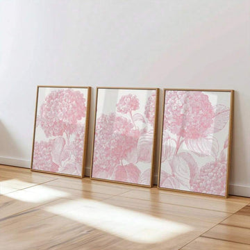 Three-piece light pink hydrangea canvas poster set in a bright living room