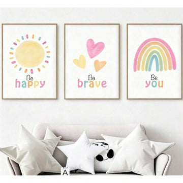 Three-piece kids wall art above sofa with Be happy sun, Be brave hearts and Be you pastel rainbow