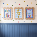 Three quote canvas posters reading Play All Day, Cool Kids Club, and Let’s Have Fun
