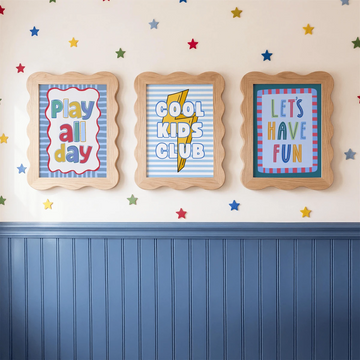 Three quote canvas posters reading Play All Day, Cool Kids Club, and Let’s Have Fun