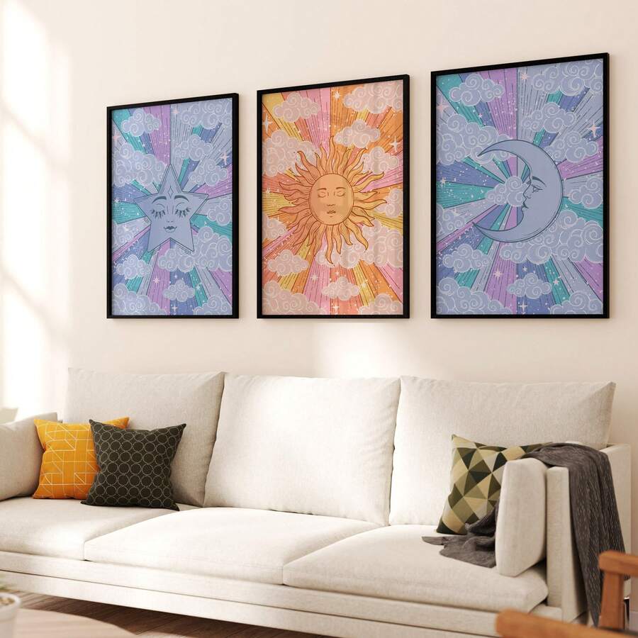 Three framed celestial posters with star, sun and crescent moon above a light living room sofa