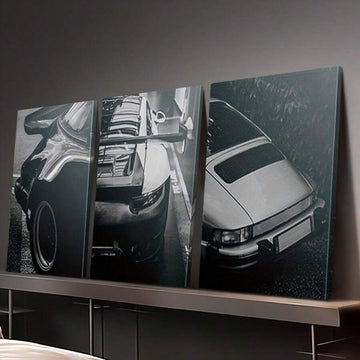Three-panel vintage classic car canvas poster set above a dark modern console