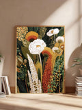 Large framed colorful botanical flower print leaning against neutral wall with books